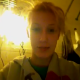 A blonde girl records herself while sitting on a toilet peeing. She says that she just finished pooping and illustrates her many imperfections on camera.